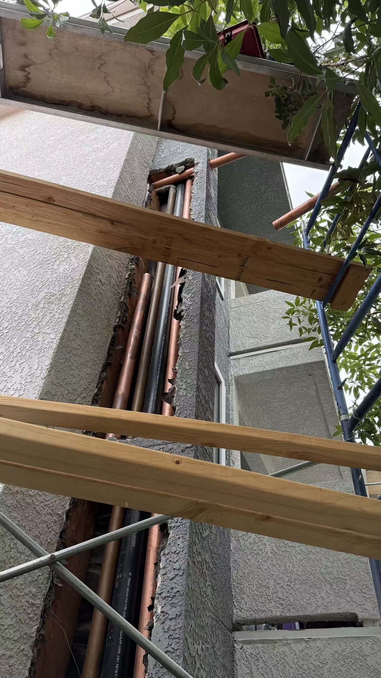 Vertical pipework within the exterior wall opening
