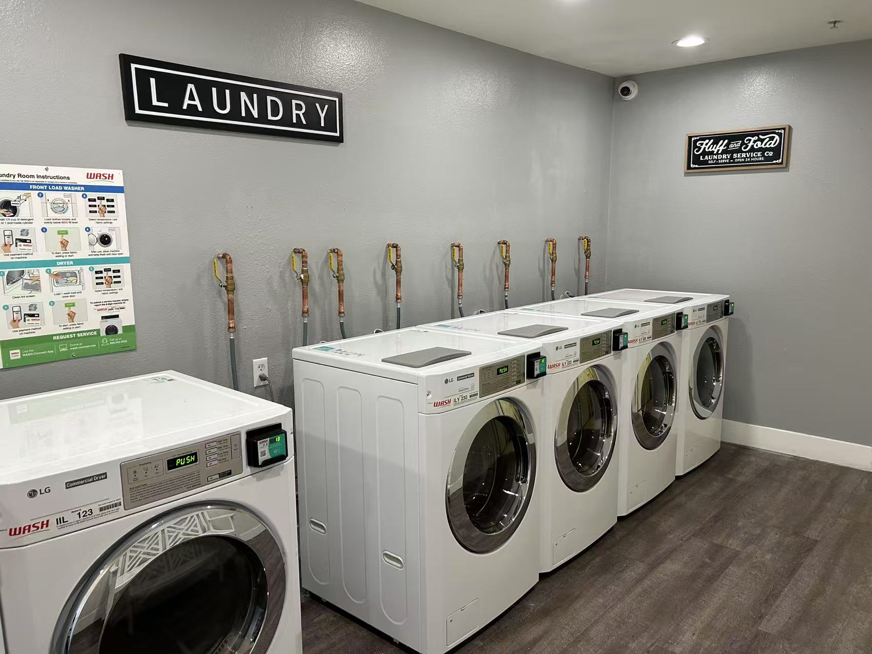 Laundry room after wall restoration and equipment placement